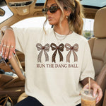 Run the Dang Ball Football Bows DTF Transfer DTF Heat Press Transfer from Sweet Tee Transfers